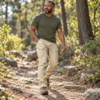 Phantom card trail — Adult man walking on a dry woodland trail in Phantom IX7 khaki cargo pants.