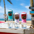 Tres botellas de viaje para mascotas con compartimentos de alimento al aire libre