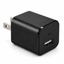 Cámara cargadora USB negra con lente oculta y puerto USB sobre fondo blanco